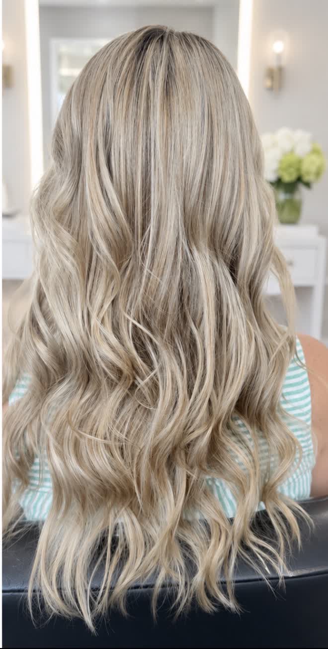 Warm golden blonde transformed to dimensional cool creamy blonde waves