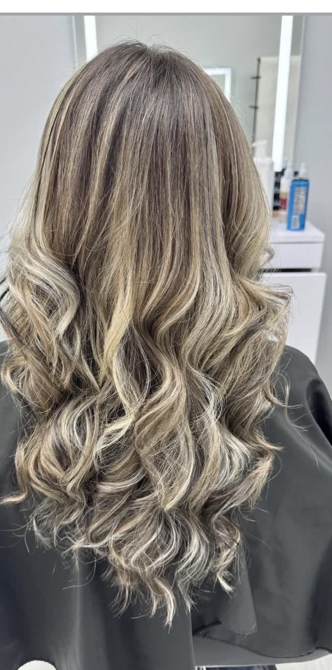 Warm brunette lifted to dimensional cool blonde — multiple angles