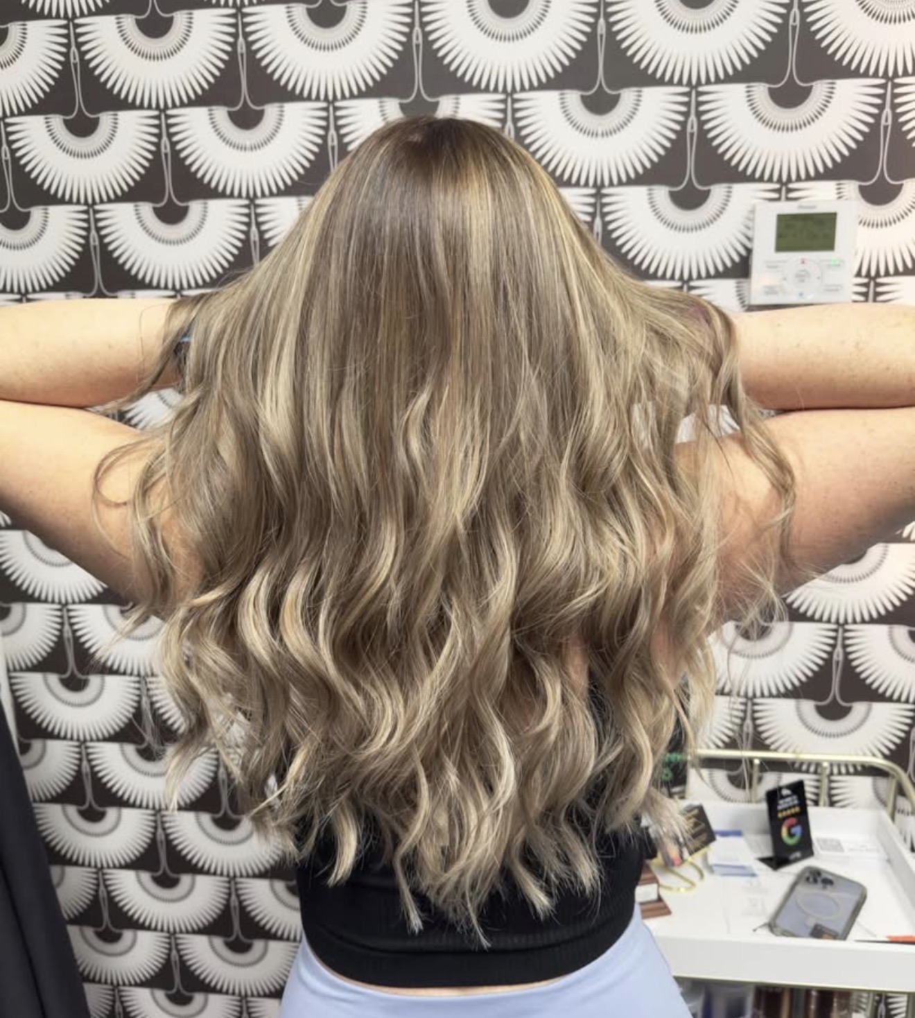 Dimensional blonde balayage with soft waves
